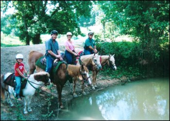 A Family enjoys a trail ride.....Priscilla, Don, Will, & Daisy.